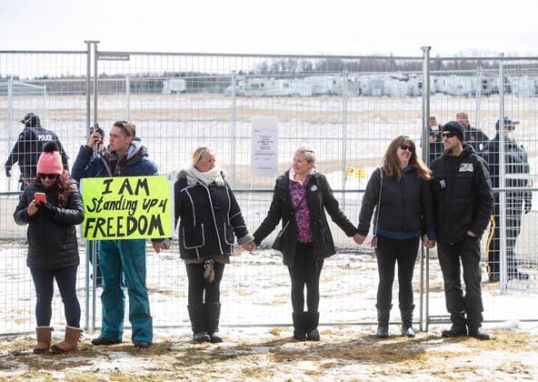 April 11, 2021, EDMONTON, ab, Canada: Supporters gather outside GraceLife Church near Edmonton, Alta., on Sunday, April 11, 2021. The church has been fenced off by police and Alberta Health Services in violation of COVID-19 rules. EDMONTON Canada  - ZUMAc35_ 20210411_zaf_c35_039 Copyright: xJasonxFransonx