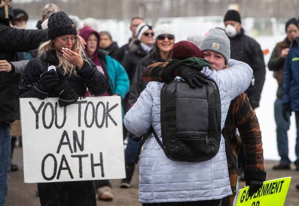 April 11, 2021, EDMONTON, ab, Canada: Supporters gather outside GraceLife Church near Edmonton, Alta., on Sunday, April 11, 2021. The church has been fenced off by police and Alberta Health Services in violation of COVID-19 rules. EDMONTON Canada  - ZUMAc35_ 20210411_zaf_c35_038 Copyright: xJasonxFransonx