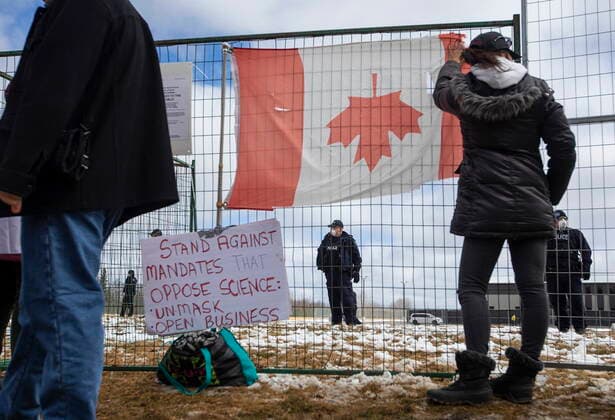 April 11, 2021, EDMONTON, ab, Canada: Supporters gather outside GraceLife Church near Edmonton, Alta., on Sunday, April 11, 2021. The church has been fenced off by police and Alberta Health Services in violation of COVID-19 rules. EDMONTON Canada  - ZUMAc35_ 20210411_zaf_c35_049 Copyright: xJasonxFransonx
