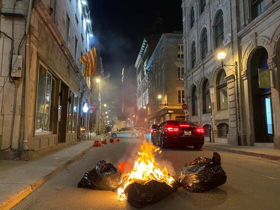April 11, 2021, Montreal, PQ, Canada: People take part in an anti-curfew protest in Montreal on Sunday April 11, 2021. Hundreds of people gathered in Old Montreal tonight in defiance of a new 8 p.m. curfew. Montreal Canada  - ZUMAc35_ 20210411_zaf_c35_068 Copyright: xGiuseppexValiantex