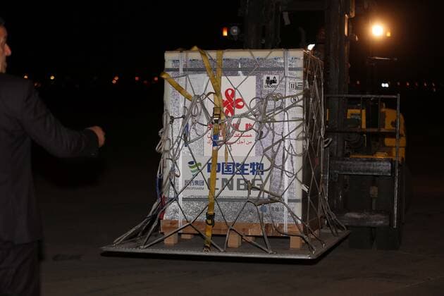 (210411) -- BAGHDAD, April 11, 2021 -- Workers transfer the COVID-19 vaccines from China at the Baghdad International Airport in Baghdad, Iraq, on April 11, 2021. Iraq on Sunday received the second batch of Sinopharm COVID-19 vaccines donated by the Chinese government to help the country combat the pandemic. (Photo by Xinhua) IRAQ-BAGHDAD-CHINA-COVID-19 VACCINES-ARRIVAL KhalilxDawood 