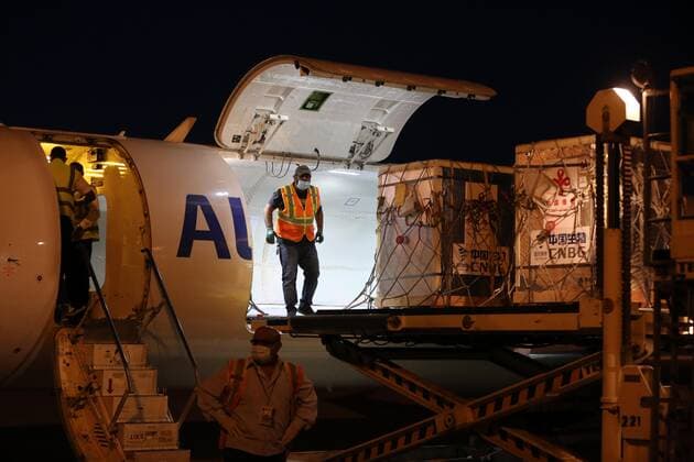 (210411) -- BAGHDAD, April 11, 2021 -- Workers unload the COVID-19 vaccines from China at the Baghdad International Airport in Baghdad, Iraq, on April 11, 2021. Iraq on Sunday received the second batch of Sinopharm COVID-19 vaccines donated by the Chinese government to help the country combat the pandemic. (Photo by Xinhua) IRAQ-BAGHDAD-CHINA-COVID-19 VACCINES-ARRIVAL KhalilxDawood 