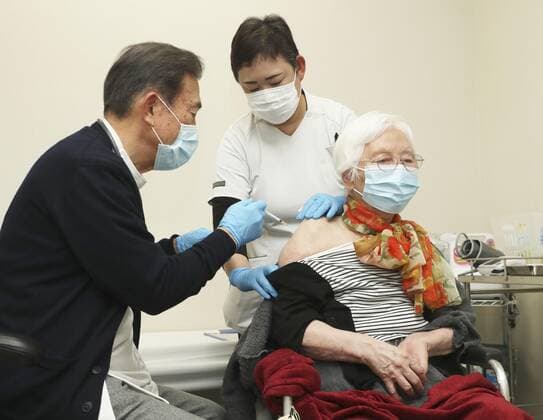 Japan starts COVID-19 vaccinations for elderly An elderly woman is inoculated against the novel coronavirus at a nursery home in Tsu in Mie Prefecture, central Japan, on April 12, 2021. The country s roughly 36 million people aged 65 or older are the second group to receive COVID-19 vaccinations following health care workers. (Pool photo) 