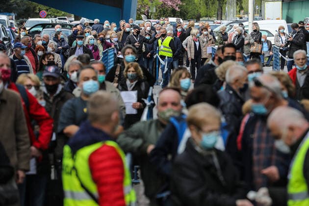 PXL_Mass vaccination in Zagreb People queue outside Zagreb Fair hall during a mass vaccination at Zagreb Fair hall in Zagreb,Croatia on April 12, 2021.By the end of the day 5,000 citizens should receive the AstraZeneca COVID-19 vaccine JuricaxGaloic PIXSELL