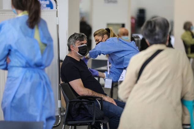 PXL_Mass vaccination in Zagreb A member of the medical staff vaccinates a patient during a mass vaccination at Zagreb Fair hall in Zagreb,Croatia on April 12, 2021.By the end of the day 5,000 citizens should receive the AstraZeneca COVID-19 vaccine JuricaxGaloic PIXSELL