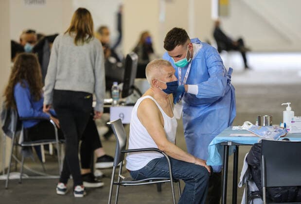 PXL_Mass vaccination in Zagreb A member of the medical staff vaccinates a patient during a mass vaccination at Zagreb Fair hall in Zagreb,Croatia on April 12, 2021.By the end of the day 5,000 citizens should receive the AstraZeneca COVID-19 vaccine JuricaxGaloic PIXSELL