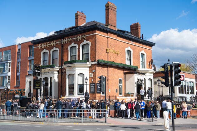 A large queue outside the Friendship Inn as people wait to drink in the beer garden of the pub, in the predominantly student area of Fallowfield, south Manchester on 12 April 2021. Customers have returned to the High Street on Monday as non-essential retailers in England and Wales reopened after more than three months of lockdown restrictions due to the Covid-19 pandemic. Manchester Greater Manchester England City centre  Copyright: xMattxWilkinsonx