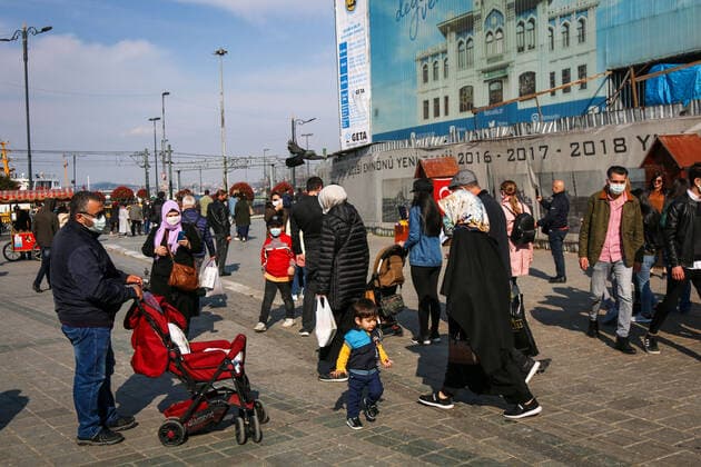 April 12, 2021, Istanbul, Turkey: People wearing masks are seen walking around the square in Eminonu, Istanbul..President Erdogan is expected to announce the new coronavirus measures to be implemented during the month of Ramadan which is starting tomorrow. Istanbul Turkey - ZUMAs197 20210412_zab_s197_056 Copyright: xHakanxAkgunx