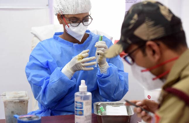 NEW DELHI, INDIA - APRIL 12: A health worker prepares a dose of Covid-19 vaccine, at Rajiv Gandhi Super Specialty Hospital, on April 12, 2021 in New Delhi, India. (Photo by Raj K Raj Hindustan Times) Over 40 lakh People Vaccinated On Second Day Of Tika Utsav