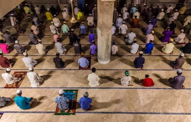 April 13, 2021, Barishal, Barishal, Bangladesh: People sat distanced lines due to Covid-19 Health Protocal and Lockdown situation during Prayer. Muslim People of Bangladesh start their mass Tarawih Prayers on April 13th. From tomorrow, Mulims will start the fasting during the following month. Barishal Bangladesh - ZUMAr337 20210413_zip_r337_062 Copyright: xMustasinurxRahmanxAlvix