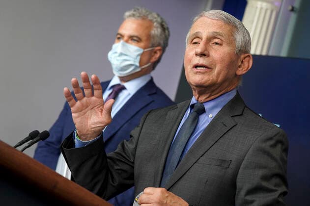 April 13, 2021, Washington, District of Columbia, USA: Chief Medical Advisor to the President Dr. Anthony Fauci answers questions as COVID-19 Response Coordinator Jeff Zients listens during a news conference in the James S. Brady Press Briefing Room at the White House in Washington, D.C., on Tuesday, April 12, 2021. Questions directed to Dr. Fauci and Response Coordinator Zients focused on the announcement that Johnson & Johnson vaccines will be halted across the country after rare clotting cases were reported Washington USA - ZUMAs152 20210413_zaa_s152_252 Copyright: xLeighxVogelx-xPoolxViaxCnpx