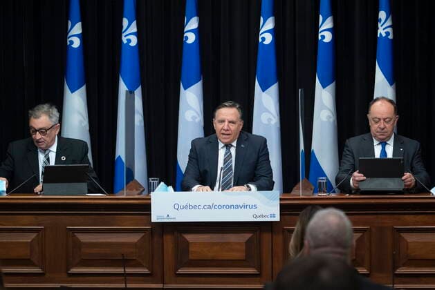 April 13, 2021, QUEBEC, PQ, Canada: Quebec Premier Francois Legault, centre, speaks during a news conference on the COVID-19 pandemic, Tuesday, April 13, 2021 at the legislature in Quebec City. Legault is flanked by Horacio Arruda, Quebec director of National Public Health, left, and Quebec Health Minister Christian Dube. QUEBEC Canada - ZUMAc35_ 20210413_zaf_c35_049 Copyright: xJacquesxBoissinotx