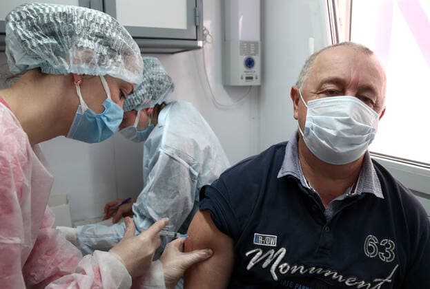 SEVASTOPOL, RUSSIA â€“ APRIL 14, 2021: A man receives the Gam-COVID-Vac vaccine (under the brand name of Sputnik V) at a mobile COVID-19 vaccination unit. Since the start of the pandemic, Sevastopol has confirmed more than 13,694 cases of COVID-19. Since mid-March, the number of new confirmed cases has been increasing in Sevastopol by more than 30 daily. Sergei Malgavko TASS  TS0FCB23