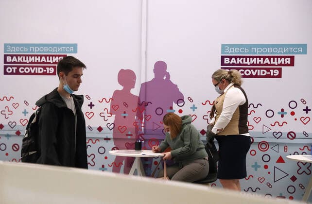 MOSCOW, RUSSIA â€“ APRIL 14, 2021: A woman fills out an informed consent form to receive the Gam-COVID-Vac vaccine (under the brand name of Sputnik V) at a mobile COVID-19 vaccination site at the Arena Plaza shopping mall; the vaccine is provided free of charge and without prior sign-up. Mikhail Tereshchenko TASS  TS0FCBAF
