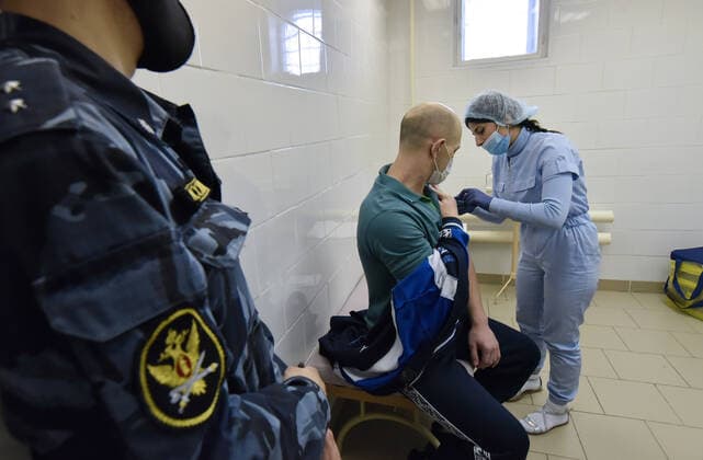 NORILSK, RUSSIA - APRIL 14, 2021: A man receives an injection of the Gam-COVID-Vac (Sputnik V) vaccine against COVID-19 at Russian Federal Penitentiary Service pre-trial detention centre No 4. Denis Kozhevnikov TASS  TS0FCBC5