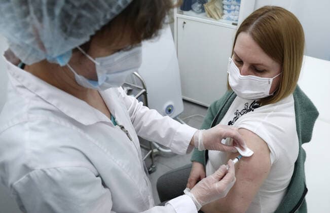 MOSCOW, RUSSIA â€“ APRIL 14, 2021: A woman receives an injection of the Gam-COVID-Vac vaccine (under the brand name of Sputnik V) at a mobile COVID-19 vaccination site at the Arena Plaza shopping mall; the vaccine is provided free of charge and without prior sign-up. Mikhail Tereshchenko TASS  TS0FCBB1