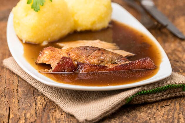 Schweinebraten mit Kartoffelknödel *** Roast pork with potato dumplings 1035308349