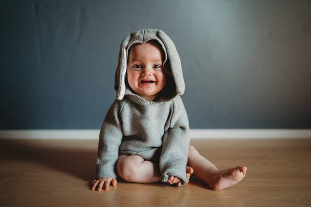 Adorable smiling baby wearing a bunny jumper for Easter Münsing, BY, Germany CR_TANI210414-699168-01 ,model released, Symbolfoto