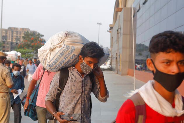 April 14, 2021, Mumbai, Maharshtra, INDIA: 14 April 2021 - Mumbai - INDIA..A migrant worker outside the Lokmanya Tilak Train station in an attempt to take a train to his village...Migrants in their thousands are Fleeing out of Mumbai & other big cities of INDIA back to their Villages in fear of a Total Lock down..Migrants fear a repeat of the events of last year when many had a tortuous experience when they tracked about 1500 kms back to their villages on FOOT when the 1st lock down was announced. Mumbai INDIA - ZUMAsu5_ 20210414_zap_su5_001 Copyright: xSubhashxSharmax