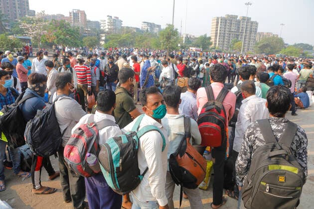 April 14, 2021, Mumbai, Maharshtra, INDIA: 14 April 2021 - Mumbai - INDIA..Migrant workers queue up outside the Lokmanya Tilak Train station to flee to their villages in fear of a Lock down..Migrants in their thousands are Fleeing out of Mumbai & other big cities of INDIA back to their Villages in fear of a Total Lock down..Migrants fear a repeat of the events of last year when many had a tortuous experience when they tracked about 1500 kms back to their villages on FOOT when the 1st lock down was announced. Mumbai INDIA - ZUMAsu5_ 20210414_zap_su5_008 Copyright: xSubhashxSharmax