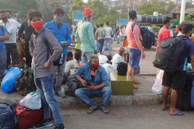 April 14, 2021, Mumbai, Maharshtra, INDIA: 14 April 2021 - Mumbai - INDIA..Migrant workers camp outside the Lokmanya Tilak Train station in an attempt to take a train to his village..Migrants in their thousands are Fleeing out of Mumbai & other big cities of INDIA back to their Villages in fear of a Total Lock down..Migrants fear a repeat of the events of last year when many had a tortuous experience when they tracked about 1500 kms back to their villages on FOOT when the 1st lock down was announced. Mumbai INDIA - ZUMAsu5_ 20210414_zap_su5_018 Copyright: xSubhashxSharmax