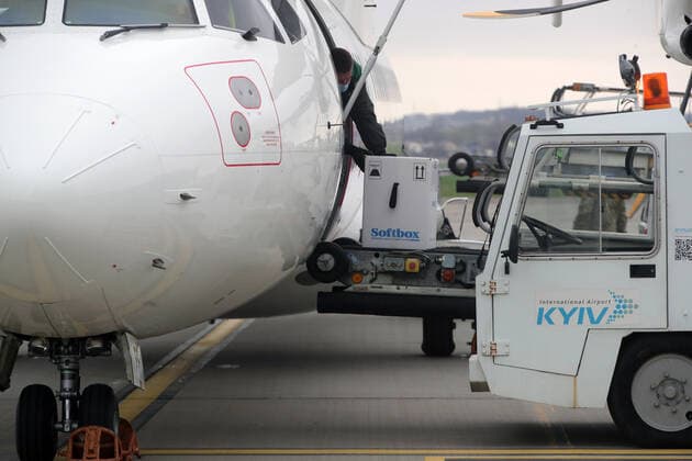 KYIV, UKRAINE - APRIL 16, 2021 - A container with the Pfizer?BioNTech COVID-19 vaccine (Comirnaty) is being reloaded from a plane at Kyiv International Airport, Kyiv, capital of Ukraine. The first batch of the Pfizer?BioNTech vaccine that contains 117,000 doses is intended for the residents of care homes and the employees of the State Emergency Service and the State Border Guard Service. Ukraine gets first batch of Pfizer vaccine  Copyright: xPavlo_Bagmutx