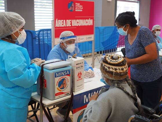 April 17, 2021, Lima, Lima, Peru: Elderly woman being inoculated with the Covid-19 vaccine in a sports center. The Peruvian Government enabled the sports venues of the Lima 2019 Pan American Games as vaccination centers. Lima Peru - ZUMAg240 20210417_zip_g240_006 Copyright: xCarlosxGarciaxGranthonx