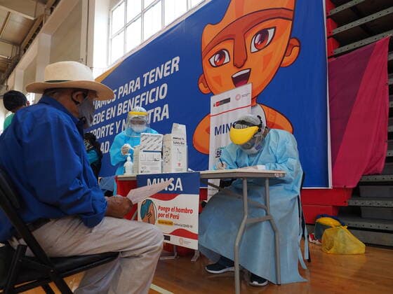 April 17, 2021, Lima, Lima, Peru: Elderly man being inoculated with the Covid-19 vaccine in a sports center. The Peruvian Government enabled the sports venues of the Lima 2019 Pan American Games as vaccination centers. Lima Peru - ZUMAg240 20210417_zip_g240_014 Copyright: xCarlosxGarciaxGranthonx