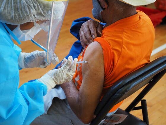 April 17, 2021, Lima, Lima, Peru: Elderly man being inoculated with the Covid-19 vaccine in a sports center. The Peruvian Government enabled the sports venues of the Lima 2019 Pan American Games as vaccination centers. Lima Peru - ZUMAg240 20210417_zip_g240_019 Copyright: xCarlosxGarciaxGranthonx