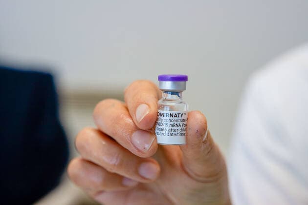 April 17, 2021, Matosinhos, Porto, Portugal: A health worker seen holding a vial containing the Cominarty vaccine..The nationwide mass vaccination of teachers and school staff started on 17th April in the Matosinhos Vaccination Centre, 1952 people were vaccinated on the first Saturday with Cominarty vaccine produced by Pfizer. Matosinhos Portugal - ZUMAs197 20210417_zaa_s197_268 Copyright: xTeresaxNunesx