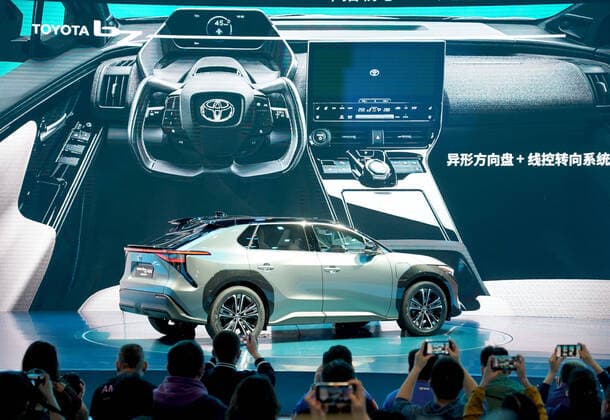 (210419) -- SHANGHAI, April 19, 2021 -- Journalists take photos of the Toyota bZ4X Concept, the first concept car of Toyota bZ series during its first world debut, at the 19th International Automobile Industry Exhibition (Auto Shanghai 2021) in Shanghai, east China, April 19, 2021. The 19th International Automobile Industry Exhibition (Auto Shanghai 2021) kicked off at the National Exhibition and Convention Center (Shanghai) Monday. Slated for April 19 to 28, Auto Shanghai 2021 is the first of the world s biggest auto shows to run normally amid the coronavirus pandemic this year. According to the organizer, 1,000 enterprises from all over the world have registered to participate in the auto show, which boasts a total exhibition area of 
