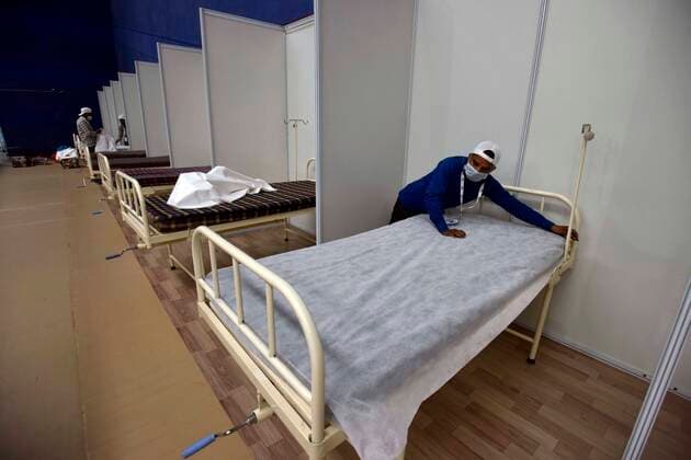 NEW DELHI, INDIA - APRIL 18: Beds being prepared inside a temporary Covid care centre, at Commonwealth Games Village Sports Complex, on April 18, 2021 in New Delhi, India. (Photo by Sanjeev Verma Hindustan Times) Daily Life Amid Coronavirus Pandemic In India