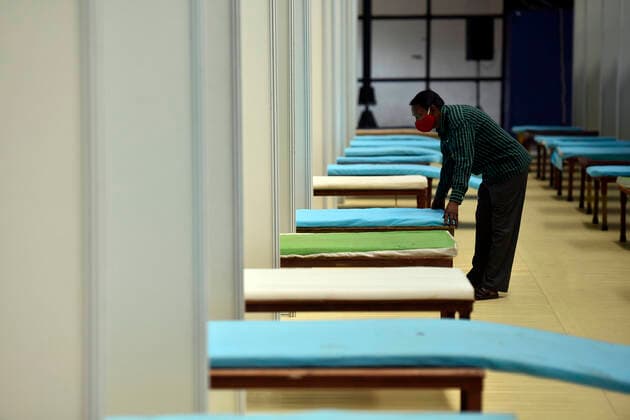 NEW DELHI, INDIA - APRIL 18: Beds being prepared inside a temporary Covid care centre, at Commonwealth Games Village Sports Complex, on April 18, 2021 in New Delhi, India. (Photo by Sanjeev Verma Hindustan Times) Daily Life Amid Coronavirus Pandemic In India