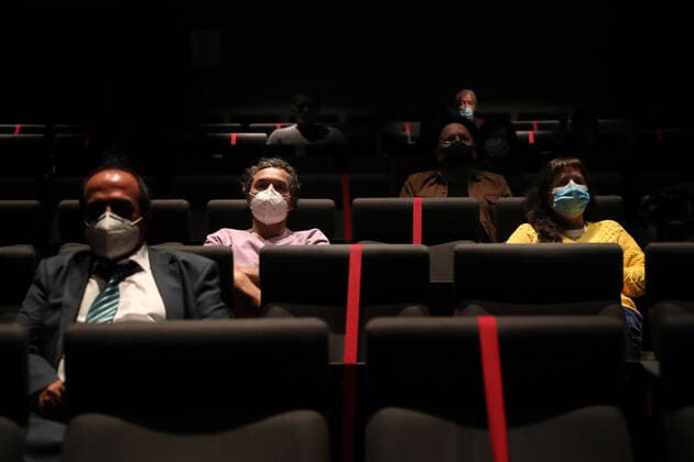 April 19, 2021, Lisbon, Portugal: People wearing face masks and keeping their social distance, watch a movie at the reopened Cinema IDEAL in Lisbon, Portugal on April 19, 2021. Portugal begins third phase of COVID-19 unlocking on Monday with the reopening of high schools, universities, cinemas, shopping malls and indoor areas of restaurants reopened in the vast majority of the mainland Portugal but stricter rules will stay in place in municipalities where transmission rates remain high. Lisbon Portugal - ZUMAf123 20210419_zap_f123_010 Copyright: xPedroxFiuzax