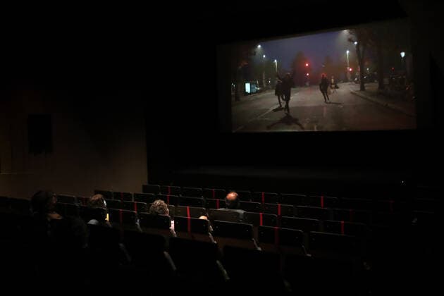 April 19, 2021, Lisbon, Portugal: People wearing face masks and keeping their social distance, watch a movie at the reopened Cinema IDEAL in Lisbon, Portugal on April 19, 2021. Portugal begins third phase of COVID-19 unlocking on Monday with the reopening of high schools, universities, cinemas, shopping malls and indoor areas of restaurants reopened in the vast majority of the mainland Portugal but stricter rules will stay in place in municipalities where transmission rates remain high. Lisbon Portugal - ZUMAf123 20210419_zap_f123_018 Copyright: xPedroxFiuzax