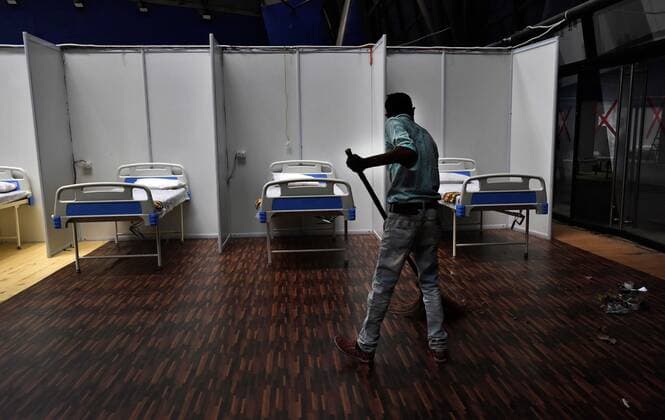 NEW DELHI, INDIA - APRIL 19: Covid facility being prepared at Commonwealth Games Village Sports Complex on April 19, 2021 in New Delhi, India. Sports complex is again turned in to Covid facility with 465 beds, including 215 beds with oxygen supply. The total capacity of the facility can be extended up to 600 beds. (Photo by Mohd Zakir Hindustan Times) Temporary Covid Care Centers Prepared In Delhi