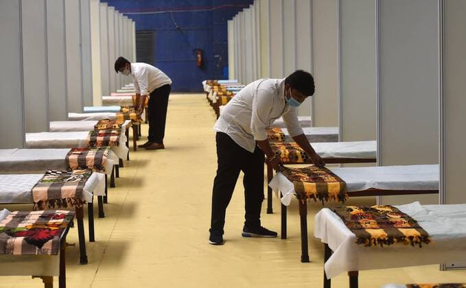 NEW DELHI, INDIA - APRIL 19: Covid facility being prepared at Commonwealth Games Village Sports Complex on April 19, 2021 in New Delhi, India. Sports complex is again turned in to Covid facility with 465 beds, including 215 beds with oxygen supply. The total capacity of the facility can be extended up to 600 beds. (Photo by Mohd Zakir Hindustan Times) Temporary Covid Care Centers Prepared In Delhi