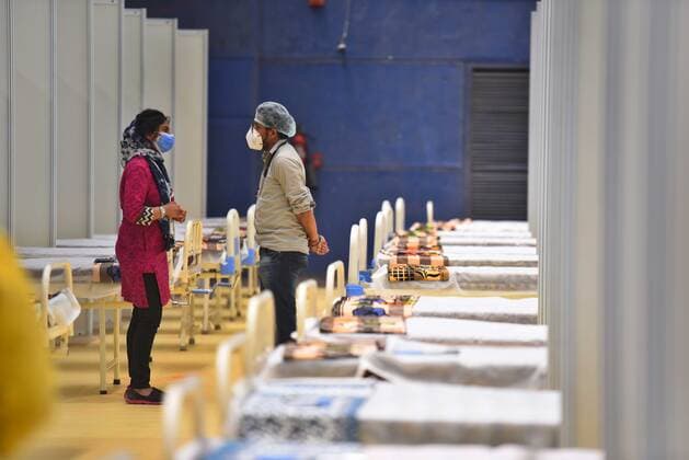 NEW DELHI, INDIA - APRIL 19: Preparations underway for a temporary Covid Care Centre at Commonwealth Games (CWG) Village near Akshadham Temple on April 19, 2021 in New Delhi, India. (Photo by Raj K Raj Hindustan Times) Temporary Covid Care Centers Prepared In Delhi
