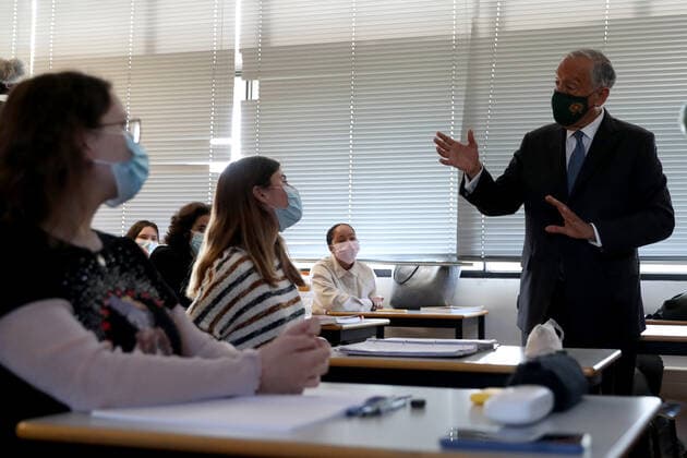 (210420) -- LISBON, April 20, 2021 -- Portuguese President Marcelo Rebelo de Sousa speaks with students during a class in Lisbon, Portugal, on April 19, 2021. Portugal on Monday proceeded to the third stage of deconfinement, or easing of COVID-19 lockdown measures, with the gradual reopening of services and other activities in municipalities with a relatively low COVID-19 incidence rate. In most of the country, schools resumed in-person education and stores, shopping centers and restaurants reopened with occupancy restrictions and in-store health and safety measures. (Photo by Xinhua) PORTUGAL-LISBON-COVID-19-3RD PHASE UNLOCKING PedroxFiuza 
