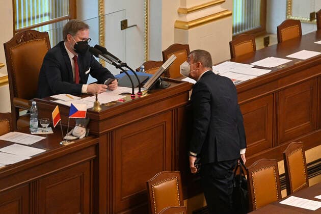 Chairman of the Civic Demokratic Party (ODS) and Vice-President of the Lower House Petr Fiala, left, talks to Czech Prime Minister Andrej Babis during the Lower House session at the Chamber of Deputies in Prague, Czech Republic, April 20, 2021. MPs are to talk about suspected involvement of Russian intelligence in 2014 Vrbetice blast, loosening of anti-epidemic restrictions. (CTKxPhoto MichalxKamaryt) CTKPhotoP2021042008661  KMT