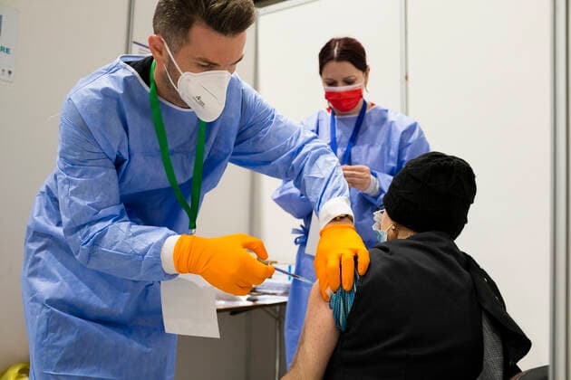 April 23, 2021, Timisoara, Timis, Romania: An elderly woman receives anti-COVID vaccine produced by Pfizer, without any previous appointment, as part of the Vaccination Marathon, at a round-the-clock vaccination center. Timisoara Romania - ZUMAp180 20210423_zip_p180_001 Copyright: xCornelxPutanx