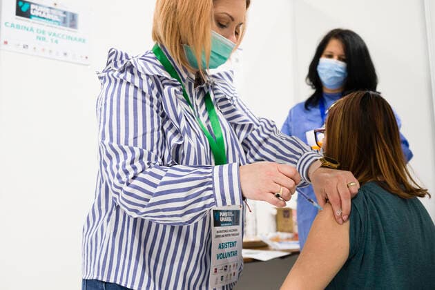 April 23, 2021, Timisoara, Timis, Romania: Woman receives anti-COVID vaccine produced by Pfizer, without any previous appointment, as part of the Vaccination Marathon, at a round-the-clock vaccination center. Timisoara Romania - ZUMAp180 20210423_zip_p180_004 Copyright: xCornelxPutanx