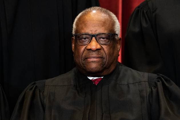 Associate Justice of the Supreme Court Clarence Thomas sits during a group photo of the Justices at the Supreme Court in Washington, DC on April 23, 2021. Copyright: xPoolxviaxCNPx MediaPunchx