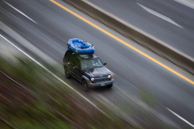 April 23, 2021, Lions Bay, BC, Canada: A motorist with an inflatable raft on the roof of a Jeep travels on the Sea-to-Sky highway between Horseshoe Bay and Lions Bay, B.C., on Friday, April 23, 2021. Non-essential travel is being restricted between three regional zones in British Columbia to try and curb the spread of COVID-19. Lions Bay Canada  - ZUMAc35_ 20210423_zaf_c35_080 Copyright: xDarrylxDyckx