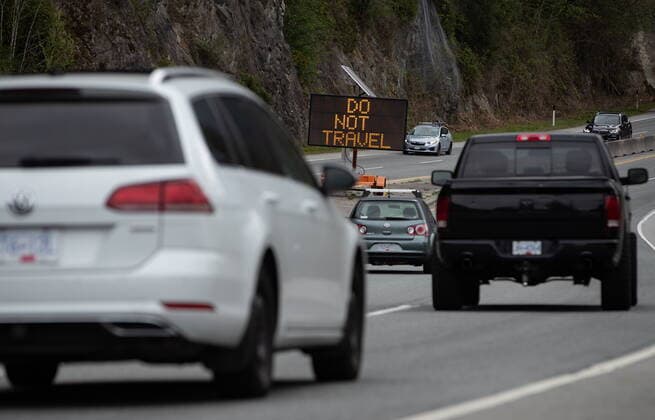 April 23, 2021, Lions Bay, BC, Canada: A digital sign with the message Do Not Travel sits on the median as motorists travel on the Sea-to-Sky highway between Horseshoe Bay and Lions Bay, B.C., on Friday, April 23, 2021. Non-essential travel is being restricted between three regional zones in British Columbia to try and curb the spread of COVID-19. Lions Bay Canada  - ZUMAc35_ 20210423_zaf_c35_084 Copyright: xDarrylxDyckx