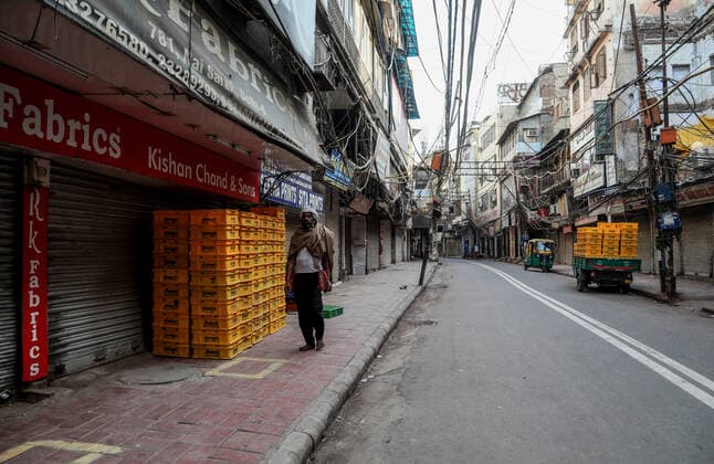 April 23, 2021, New Delhi, India: A man walks past a closed market during the weekend lockdown imposed by the Delhi government to curb the spread of coronavirus disease..India is running out of oxygen during the second wave of Covid-19 pandemic. India has recorded 332,730 new Covid-19 cases in a single day and 2,263 deaths in the last one day. New Delhi India - ZUMAs197 20210423_zaa_s197_338 Copyright: xNaveenxSharmax