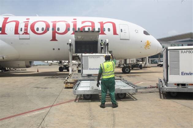 (210424) -- LOME, April 24, 2021 -- Staff members unload a batch of Sinovac vaccine donnated by China at the Gnassingbe Eyadema International Airport in Lome, Togo, April 23, 2021. The government of Togo received a batch of Sinovac vaccine donnated by China on Friday in support to its fight against COVID-19 as part of the cooperation between the two countries. (Photo by Xinhua) TOGO-LOME-COVID-19-SINOVAC-VACCINE Koffi 