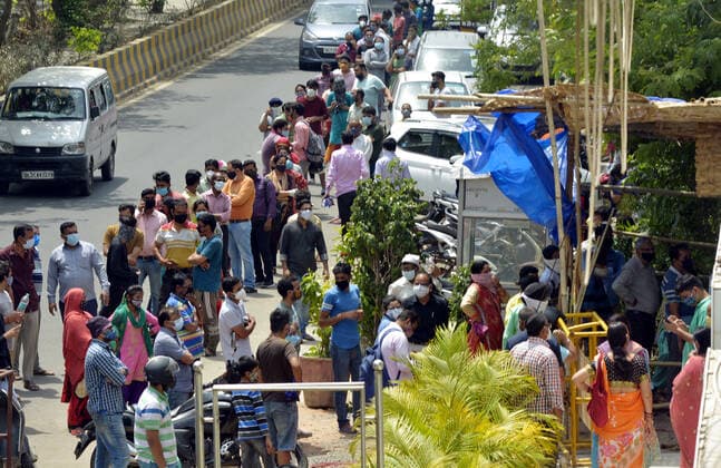 GHAZIABAD, INDIA - APRIl 23: Peeople wait to avail Covid-19 testing facilities organised by a Sikh social organization at Indirapuram Gyan Khand 4, on April 23, 2021 in Ghaziabad, India. (Photo by Sakib Ali Hindustan Times) Daily Life Amid Coronavirus Pandemic In India