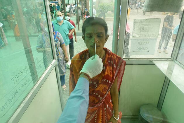 NOIDA, INDIA - APRIl 23: A health worker collects a swab sample for Covid-19 test, a district hospital at sector 30, on April 23, 2021 in Noida, India. (Photo by Sunil Ghosh Hindustan Times) Medical Team Conducts COVID-19 Coronavirus Test