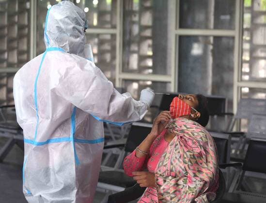 CHANDIGARH, INDIA - APRIl 23: A woman gives her swab sample for Covid-19 testing at ISBT Sector 17, on April 23, 2021 in Chandigarh, India. (Photo by Keshav Singh Hindustan Times) Medical Team Conducts COVID-19 Coronavirus Test